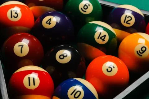 Billiard balls in a pool table. Stock Photos
