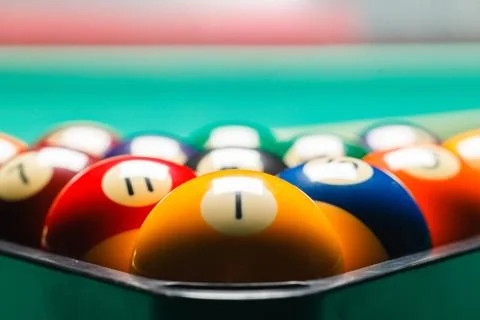 Billiard balls in a pool table. Stock Photos