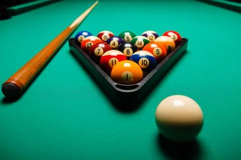 Billiard balls in a pool table. Stock Photos