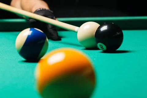 Billiard balls in a pool table. Stock Photos