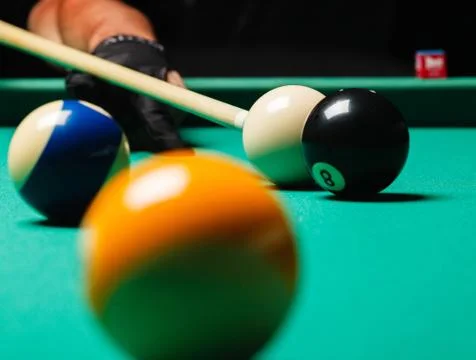 Billiard balls in a pool table. Stock Photos