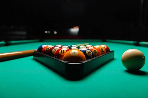 Billiard balls in a pool table. Stock Photos