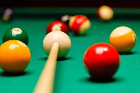 Billiard balls in a pool table. Stock Photos