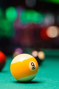 Billiard balls in a pool table. Stock Photos