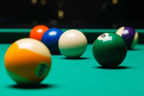Billiard balls in a pool table. Stock Photos