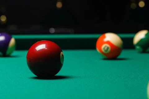 Billiard balls in a pool table. Stock Photos