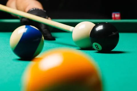 Billiard balls in a pool table. Stock Photos