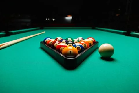 Billiard balls in a pool table. Stock Photos