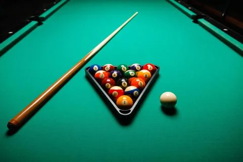 Billiard balls in a pool table. Stock Photos