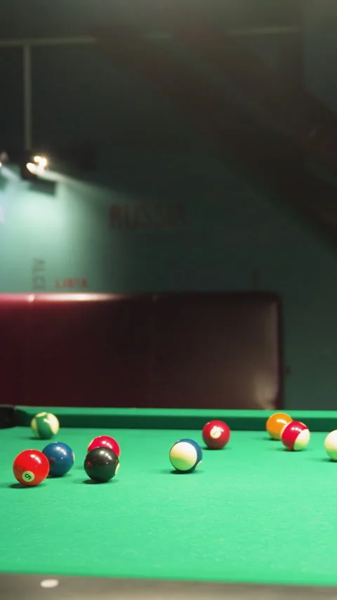 Billiard Balls Scattered on Green Pool Table After Break Shot in Motion Stock Footage 319784334
