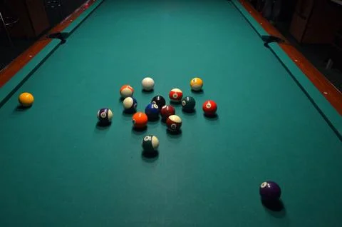 Billiard balls scattered on a pool table Фото
