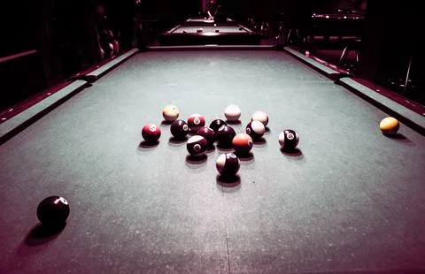Billiard balls scattered on a pool table 库存照片