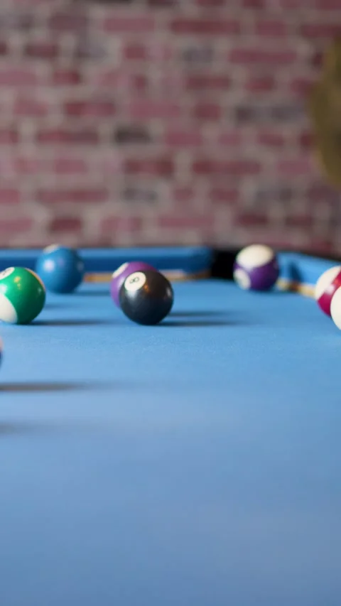 Billiard Balls Scattering After Break Shot on Blue Pool Table Stock Footage 317064549