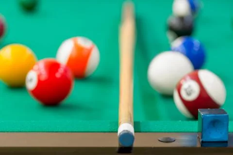 Of billiard balls on the table out of focus Stock Photos