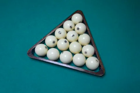 Billiard balls in the triangle on the table Stock Photos