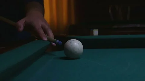 Billiard cue hitting white ball in close up video Stock Footage 339029214