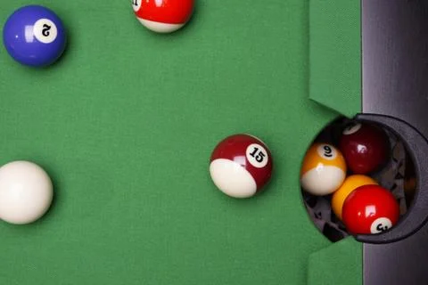 Billiard on green table Stock Photos