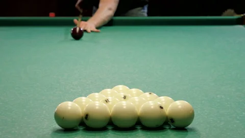 Billiard opening break shot. Man playing billiards, hitting balls with a cue. 4K Stock-Footage 109451680
