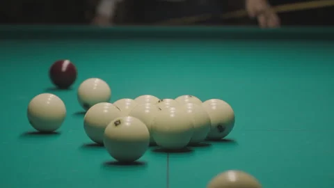 Billiard player breaks a pyramid or triangle of white billiard balls, starts the Stock Footage 319206819