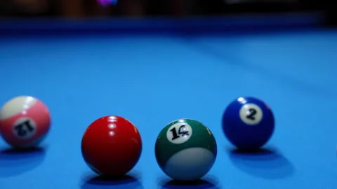 Billiard player smooth precise play with cue aiming at colorful balls opening Stock Footage 333311043