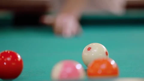 Billiard pool table shows snooker balls arranged for game play, is hitting by Stock Footage 333266201
