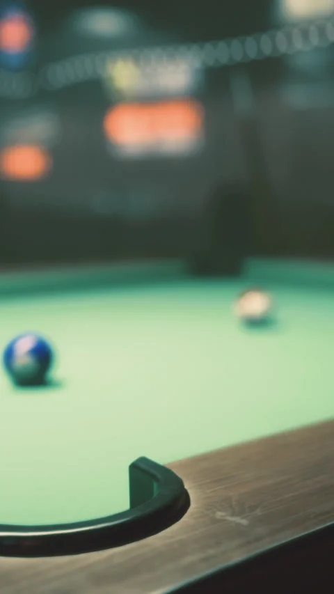 Billiard table with balls set for a game in a dimly lit room Stock Footage 334166513