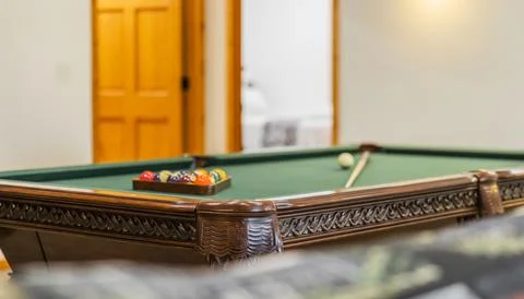 Billiard table in an empty room Stock Photos