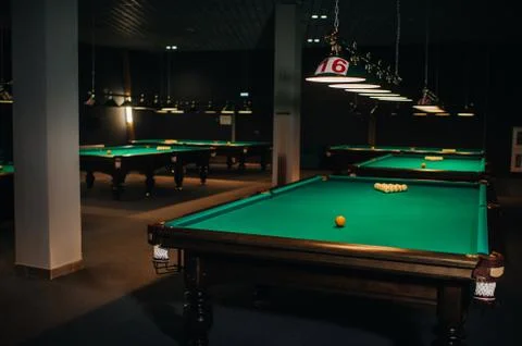 Billiard table with green surface and balls in the billiard club.Pool Game Stockfoto's