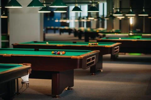Billiard table with green surface and balls in the billiard club.Pool Game 스톡 사진