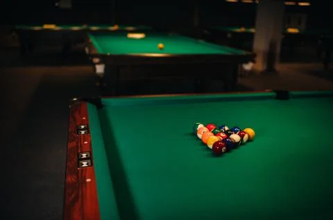 Billiard table with green surface and balls in the billiard club.Pool Game 스톡 사진