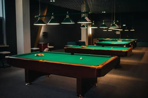 Billiard table with green surface and balls in the billiard club.Pool Game 스톡 사진
