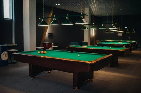Billiard table with green surface and balls in the billiard club.Pool Game Stockfoto's