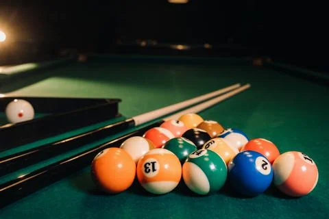 Billiard table with green surface and balls in the billiard club.Pool Game Stockfoto's