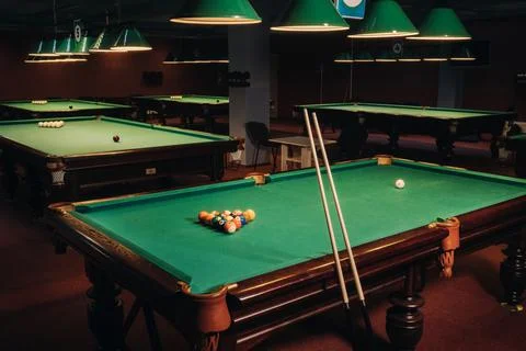 Billiard table with green surface and balls in the billiard club.Pool Game Foto stock