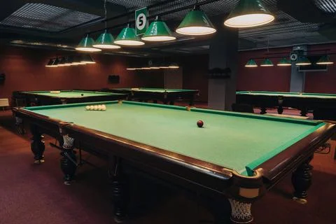 Billiard table with green surface and balls in the billiard club.Pool Game 스톡 사진
