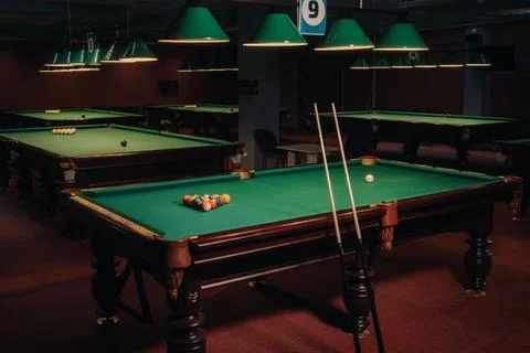 Billiard table with green surface and balls in the billiard club.Pool Game Stock Photos