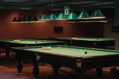 Billiard table with green surface and balls in the billiard club.Pool Game Stock Photos