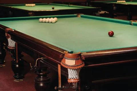 Billiard table with green surface and balls in the billiard club.Pool Game Stockfoto's