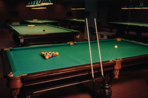 Billiard table with green surface and balls in the billiard club.Pool Game Stockfoto's
