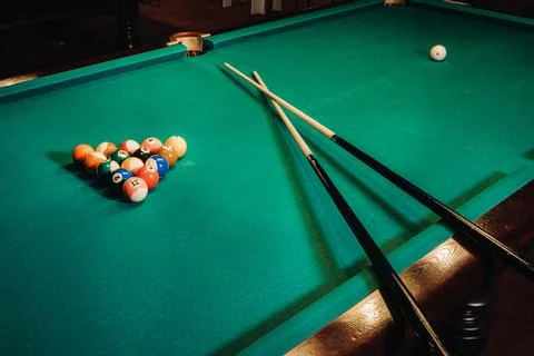 Billiard table with green surface and balls in the billiard club.Pool Game Foto stock