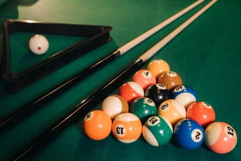 Billiard table with green surface and balls in the billiard club.Pool Game Foto stock
