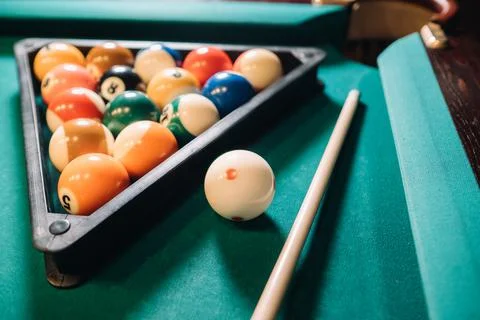 Billiard table with green surface and balls in the billiard club.Pool Game 스톡 사진