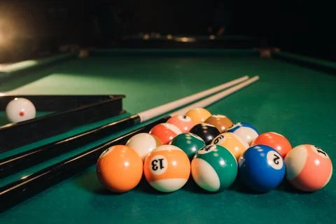 Billiard table with green surface and balls in the billiard club.Pool Game Stockfoto's