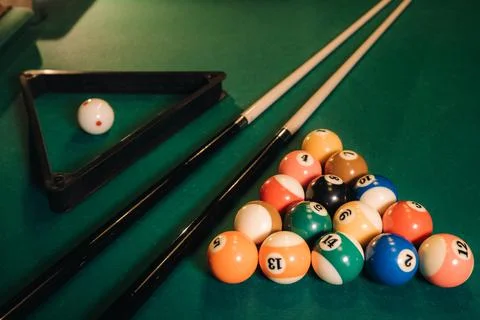 Billiard table with green surface and balls in the billiard club.Pool Game Foto stock