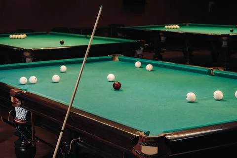 Billiard table with green surface and balls in the billiard club.Pool Game Foto stock