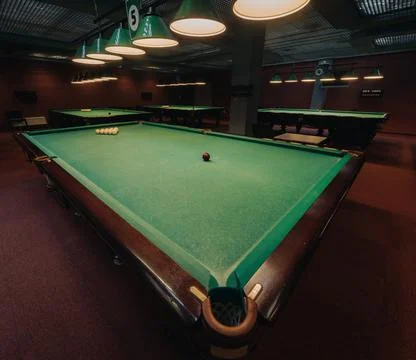Billiard table with green surface and balls in the billiard club.Pool Game 스톡 사진