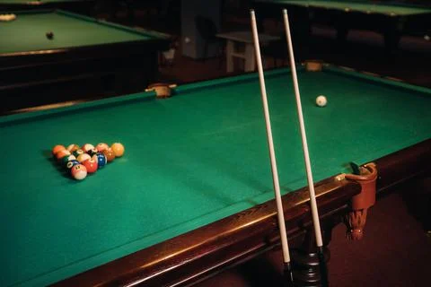 Billiard table with green surface and balls in the billiard club.Pool Game Stockfoto's