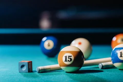 Billiard table with green surface and balls in the billiard club.Pool Game Stockfoto's