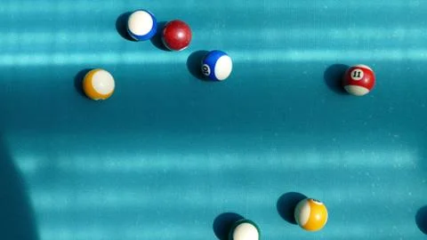 Billiard table with multi-colored balls Stock Photos