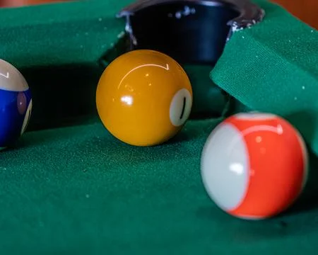 Billiard table setup featuring colorful pool balls, ready for an exciting g.. Stock Photos